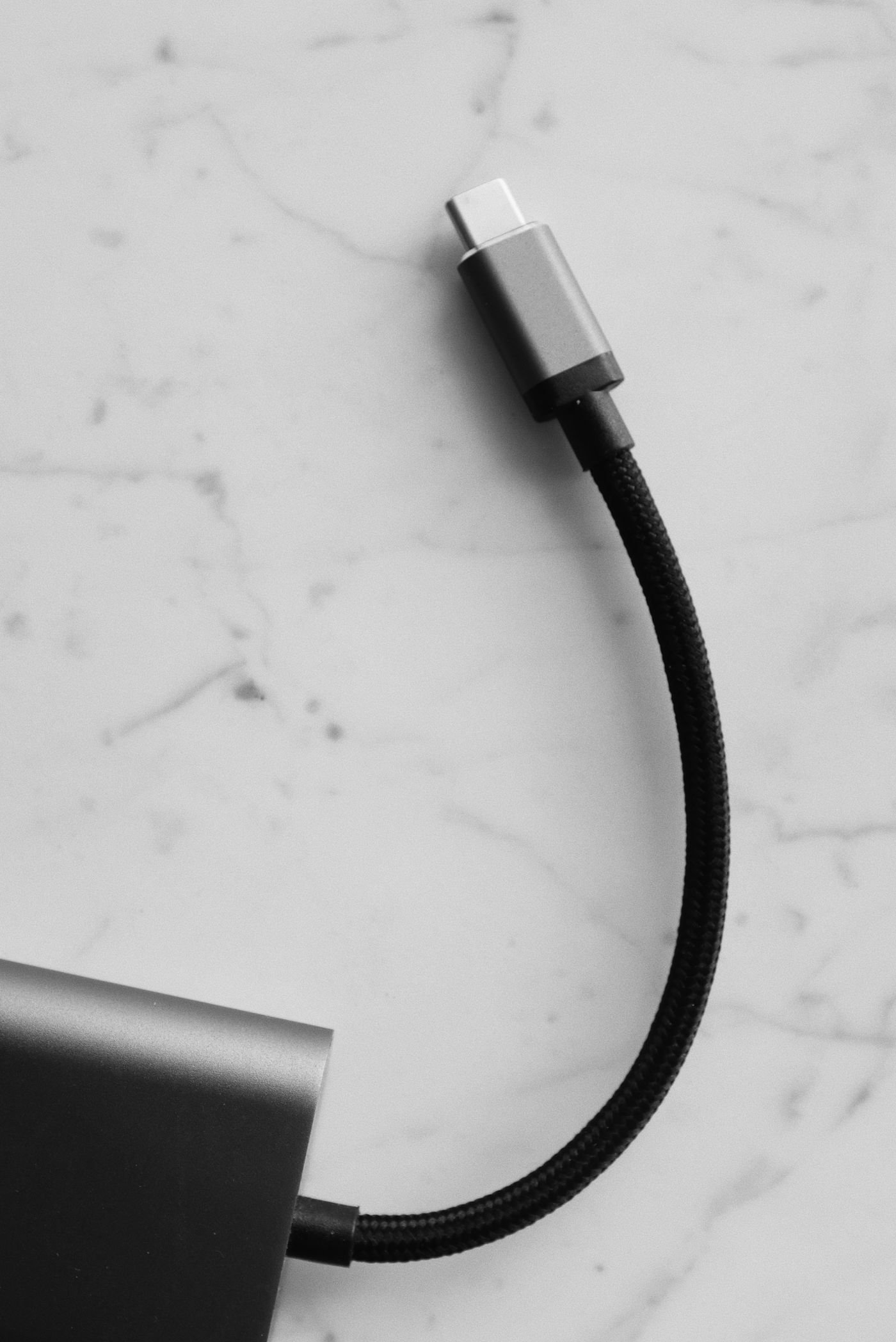 A cable connector resting on a light marble surface