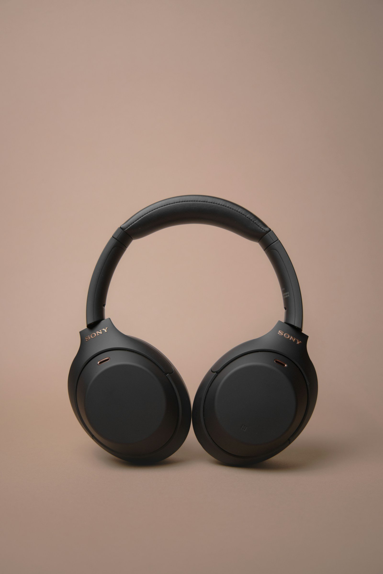 Black over-ear headphones photographed against a neutral background